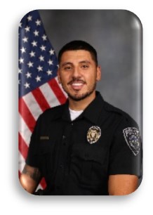 Headshot of officer with flag